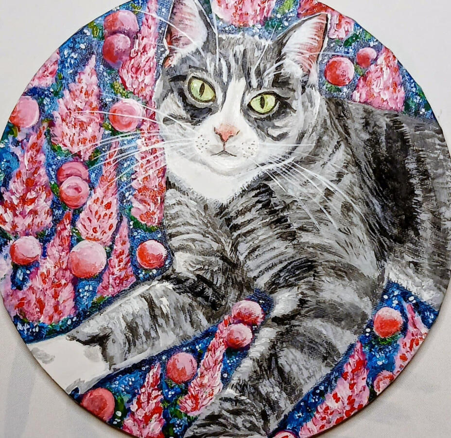 Round canvas done with acrylic. Gray striped cat on pink and blue background. Pink flowers on background